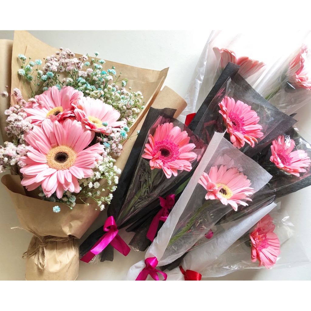 Pink gerbera daisy flower bouquet wraps with mixed pink, blue and white