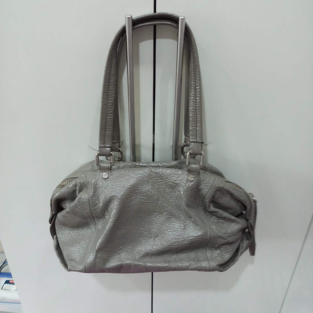 Club Monaco Bag (Category: Luxury Bags & Wallets) located in Quezon City. Submitted by mystylecoma (Listing ID 167330857, Image 1). Description: Its my favorite bag Gray medium bag very useful dami ko nalalagay inside magaan sya .may pen stain inside needs cleaning pwede labahan inside..