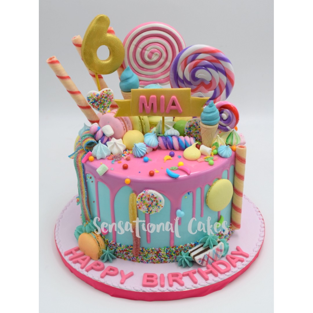 Drip cake pastel pink teal candy lollipop girl cake 