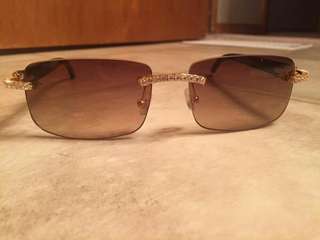 White iced out Cartier buffs