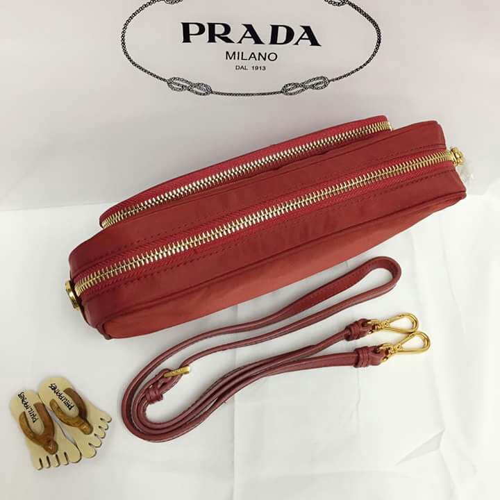 Prada Red Nylon slingbag (Category: Luxury Bags & Wallets) located in Manila. Submitted by mylittlewardrobe88 (Listing ID 168166133, Image 2). Description: Authentic high end Prada 24x15cm With papaerbag and receipt.