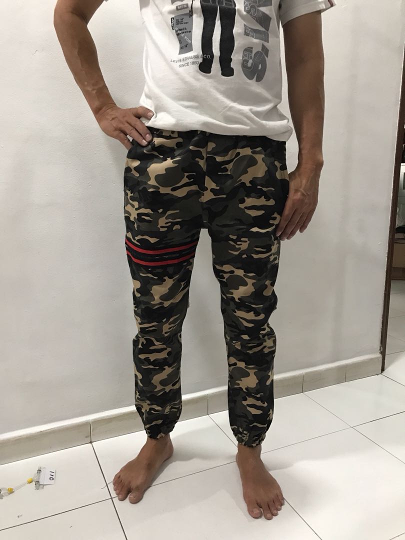 camouflage pants with red stripe