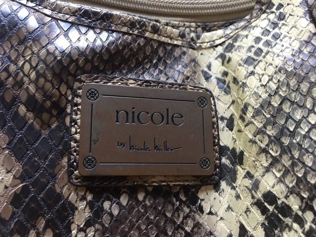 Nicole Miller 7-pocket bag (Category: Cross-body Bags) located in Quezon City. Submitted by starmax79 (Listing ID 169314192, Image 2). Description: Brand: Nicole Miller.