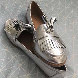 RUBI metallic tasseled flats