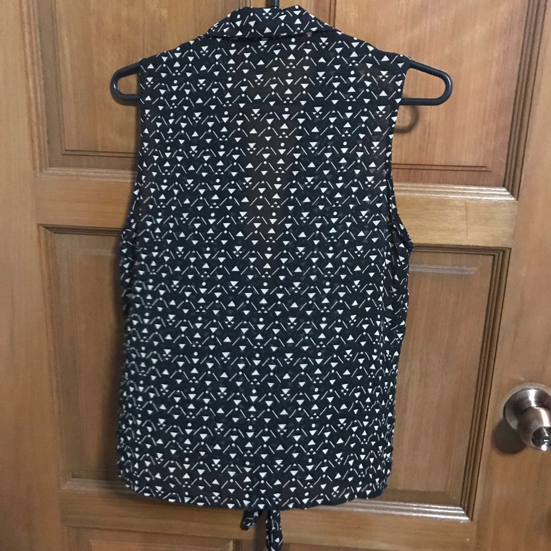 long sheer sleeveless vest