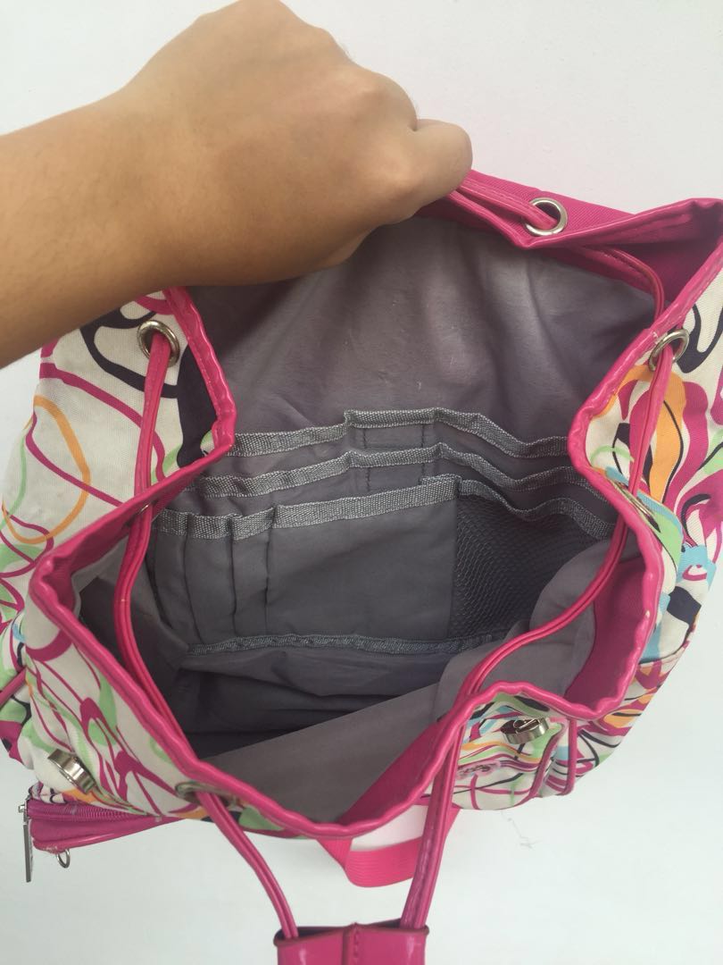 Ruffles Pink Backpack (Category: Backpacks) located in Cavite. Submitted by huggiebaby (Listing ID 169018102, Image 3). Description: bag is lightly used. what’s great about this bag is that it has a lot of storage. very ideal as a school bag. has lot of pockets and is cute and light. kids will definitely love it!! note: however there’s a small defect on the right magnet part since its a bit hard to unbutton. i suggest to rub some oil on both magn