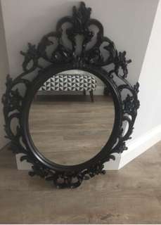Black oval mirror