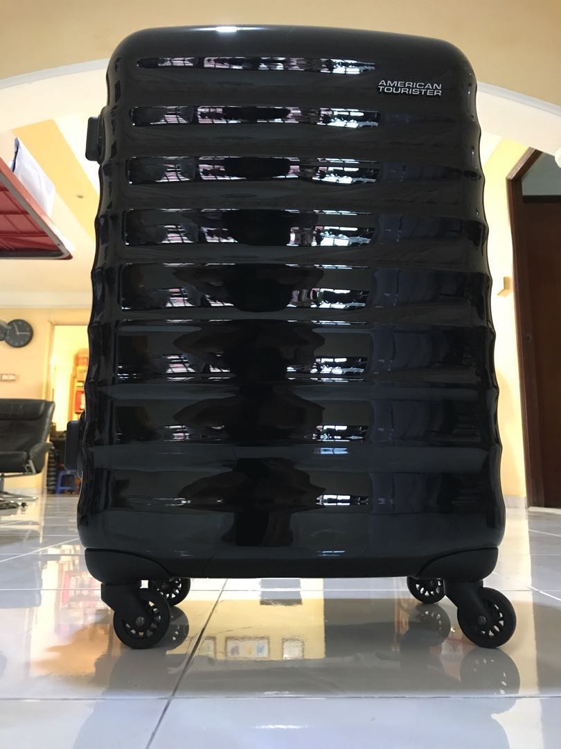 american tourister paralite spinner