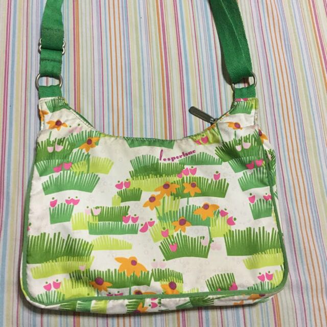 LESPORTSAC sling / Body bag only (Category: Cross-body Bags) located in Muntinlupa City. Submitted by mystyle10 (Listing ID 151629284, Image 2). Description: Preloved bag, just needs cleaning This can be a shoulder bag or a body bag Authentic, includes 1 pouch No haggling pls. Last price posted.