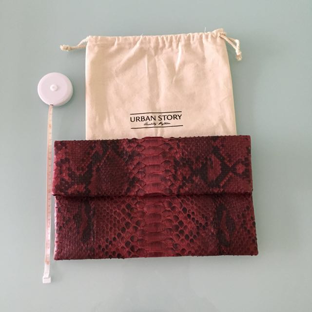 Python clutch (Category: Clutches) located in Singapore. Submitted by pnypmaru (Listing ID 103474475, Image 2). Description: Brand new red python clutch from Urban Story. Comes with dust bag. Measures approximately 29cm (length) by 18cm (height). https://urbanstory-store.com/collections/snakeskin-clutches.