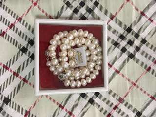 Natural pearl necklace, bracelet and earrings.