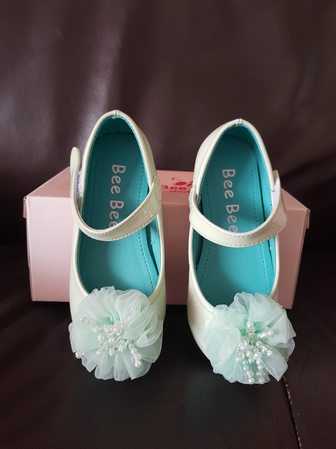 mint green baby shoes
