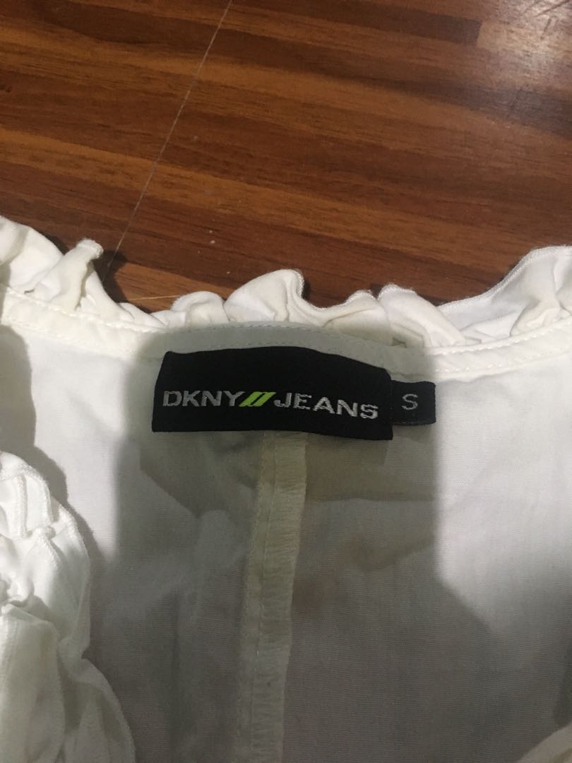dkny white ruffle blouse (Category: Blouses) located in Manila. Submitted by decluttermaster (Listing ID 174055452, Image 1). Description: dkny jeans white sleeveless ruffle blouse.