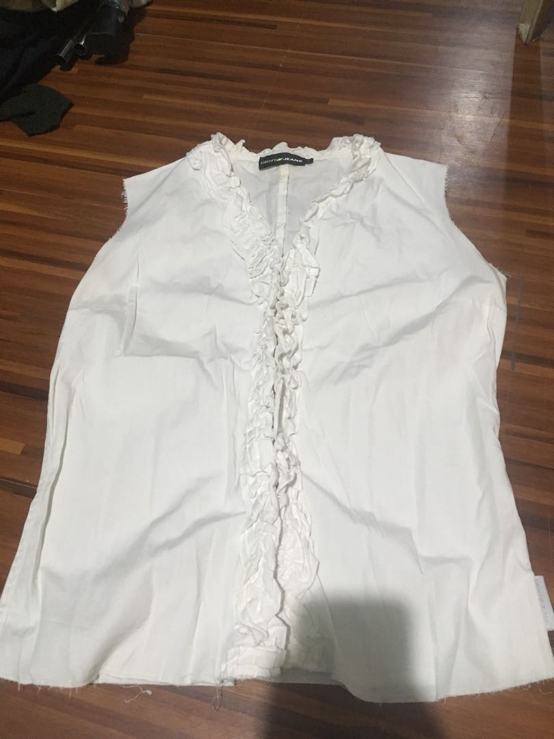 dkny white ruffle blouse (Category: Blouses) located in Manila. Submitted by decluttermaster (Listing ID 174055452, Image 2). Description: dkny jeans white sleeveless ruffle blouse.