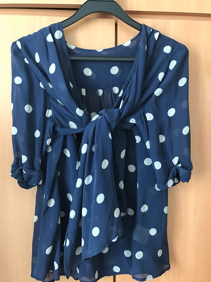navy blue blouse with white polka dots