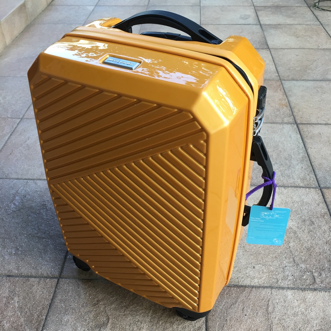 yellow hard luggage