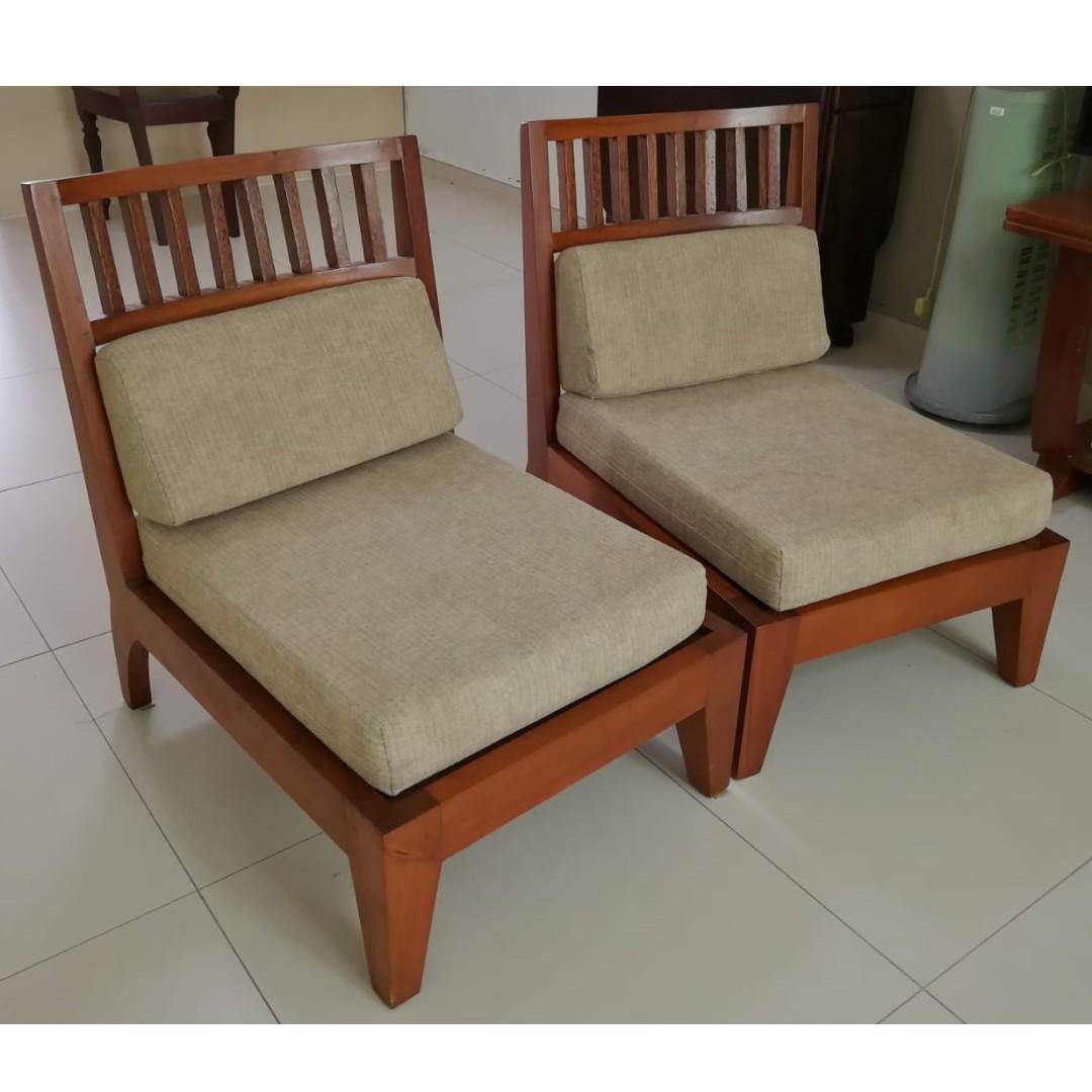 two singleseater wooden chairs without armrests used