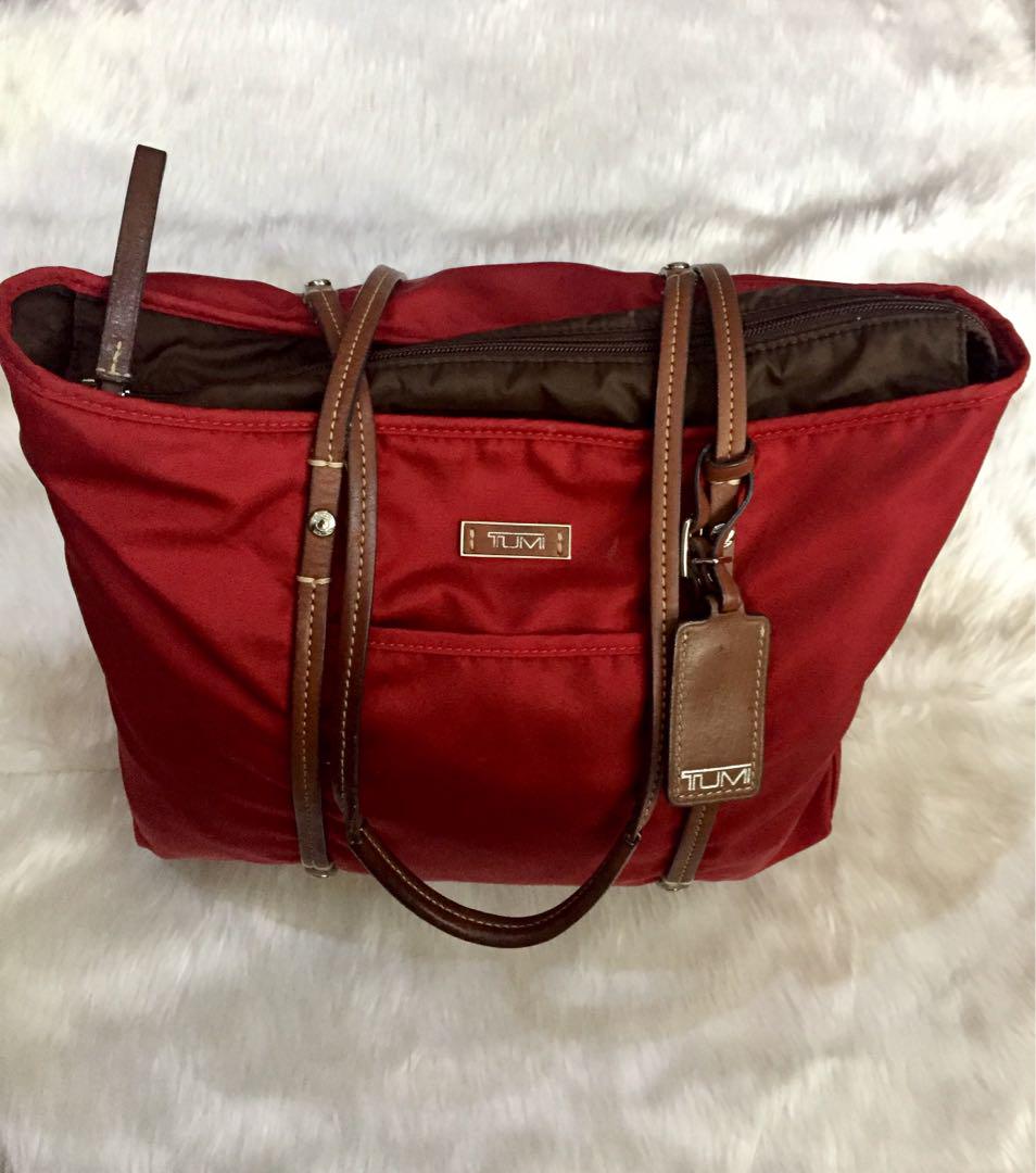 tumi red luggage
