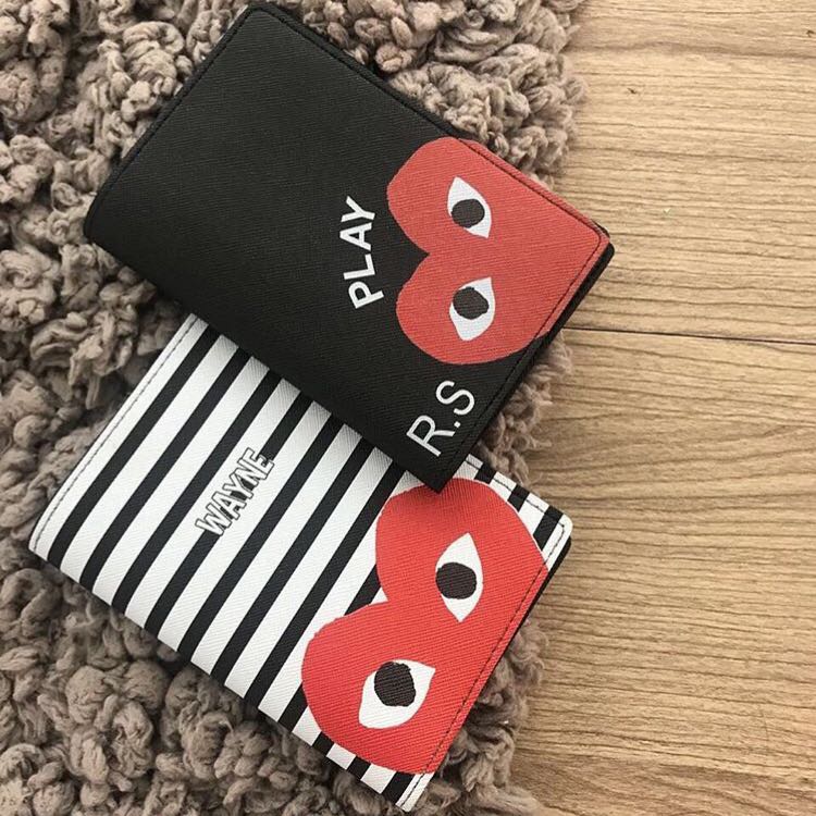 comme des garcons passport holder