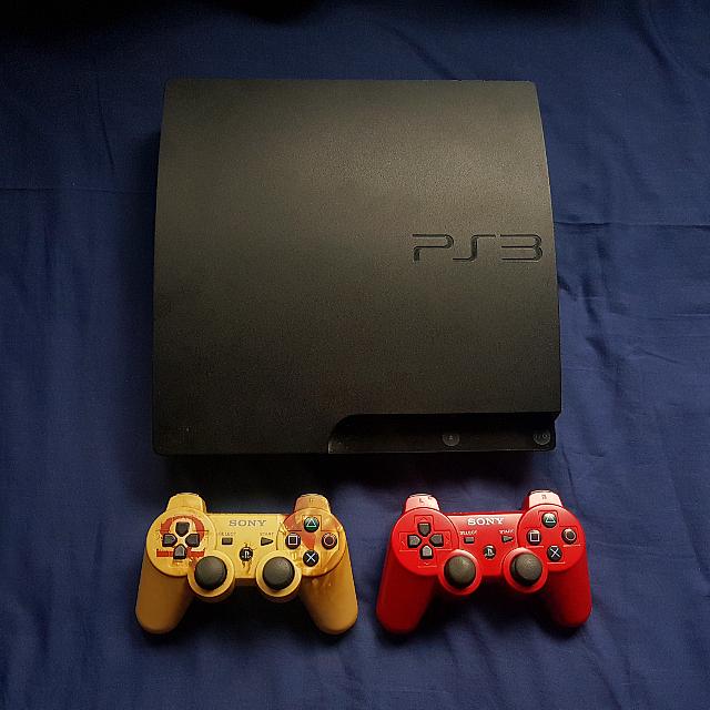 PS3 Slim Console + 3 Dualshock controllers (Inc. God Of War Edition