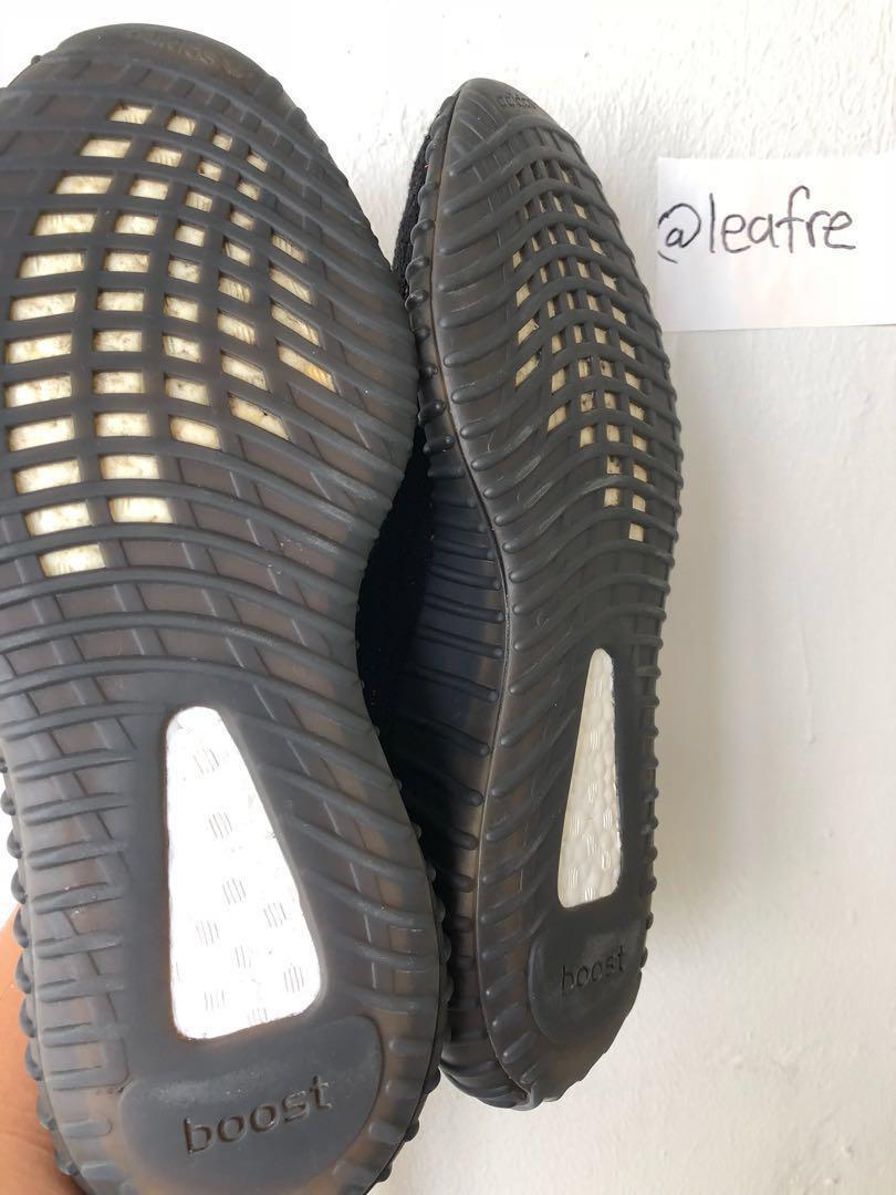 black yeezys with pink stripe