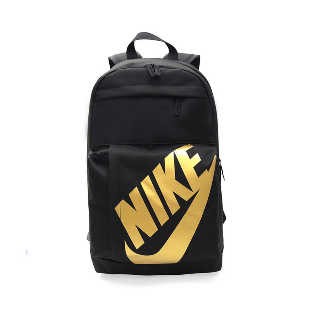 gold nike bag