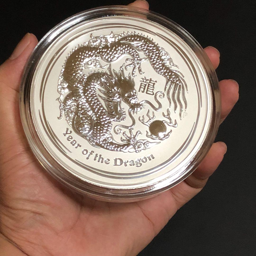 Rare Perth Mint 1kg Giant Pure Silver DRAGON Year 2012 bullion kilo coin. (Category: Everything Else) located in Singapore. Submitted by genuinetreasurebox (Listing ID 176399513, Image 3). Description: 1 Giant .999 Silver RARE DRAGON Perth Mint 2012 bullion kilo coin. This is an outright massive pure silver coin from Perth Mint in original coin capsule. 2012 Year of DRAGON Lunar series 0.999 Silver 1kg bullion coin. It is a very impressive desk t