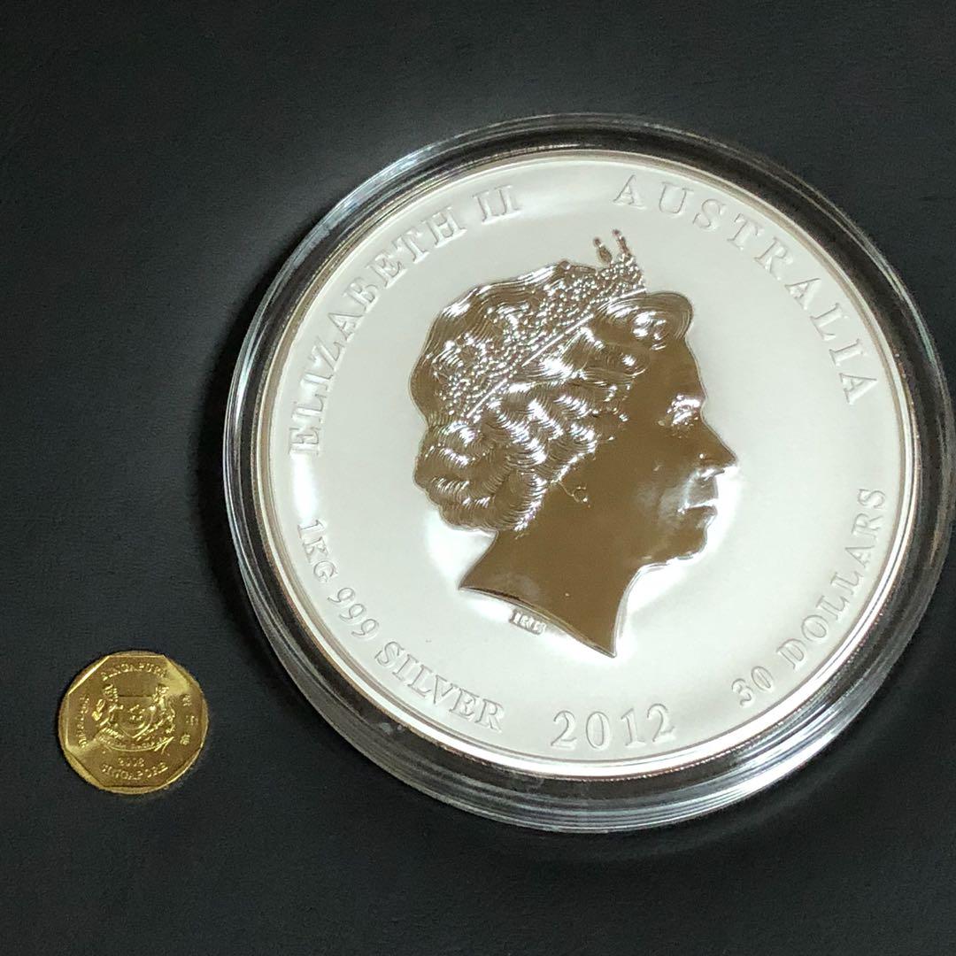 Rare Perth Mint 1kg Giant Pure Silver DRAGON Year 2012 bullion kilo coin. (Category: Everything Else) located in Singapore. Submitted by genuinetreasurebox (Listing ID 176399513, Image 2). Description: 1 Giant .999 Silver RARE DRAGON Perth Mint 2012 bullion kilo coin. This is an outright massive pure silver coin from Perth Mint in original coin capsule. 2012 Year of DRAGON Lunar series 0.999 Silver 1kg bullion coin. It is a very impressive desk t