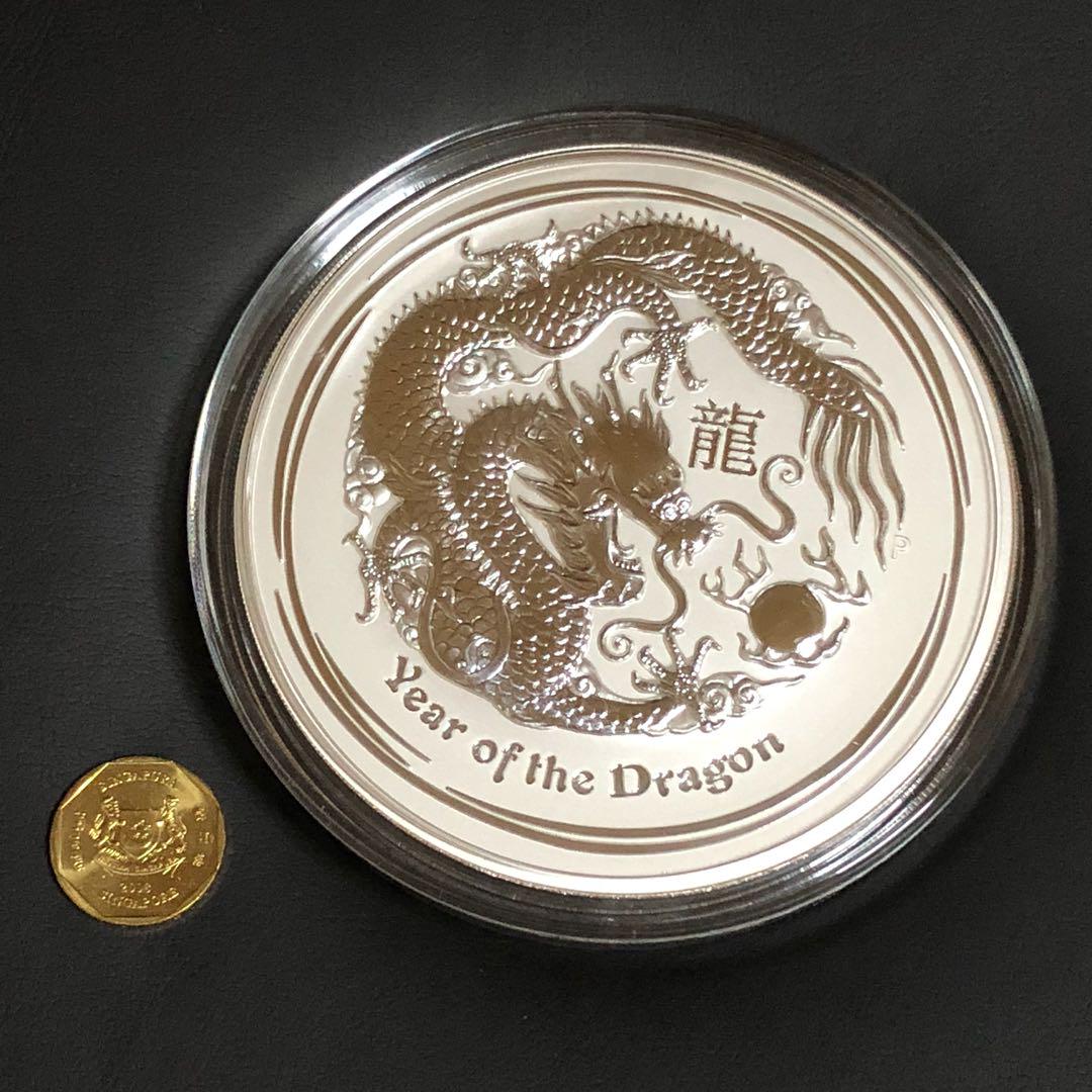 Rare Perth Mint 1kg Giant Pure Silver DRAGON Year 2012 bullion kilo coin. (Category: Everything Else) located in Singapore. Submitted by genuinetreasurebox (Listing ID 176399513, Image 1). Description: 1 Giant .999 Silver RARE DRAGON Perth Mint 2012 bullion kilo coin. This is an outright massive pure silver coin from Perth Mint in original coin capsule. 2012 Year of DRAGON Lunar series 0.999 Silver 1kg bullion coin. It is a very impressive desk t