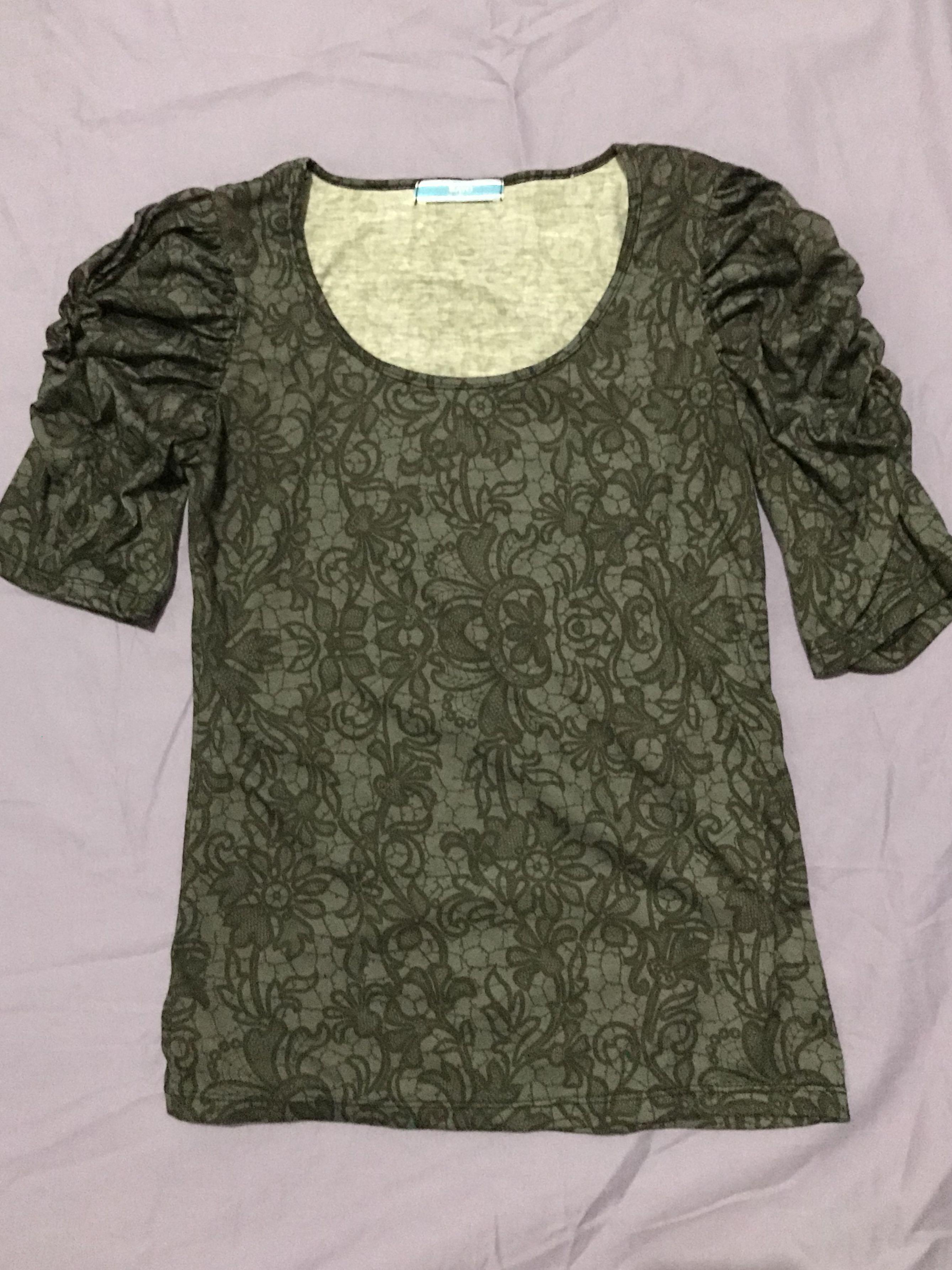 Bayo dark gray blouse (Category: Blouses) located in Quezon City. Submitted by morems (Listing ID 176647390, Image 1). Description: Dark gray Bayo three fourths longsleeves Chest width -17 in Shirt length - 23 in.