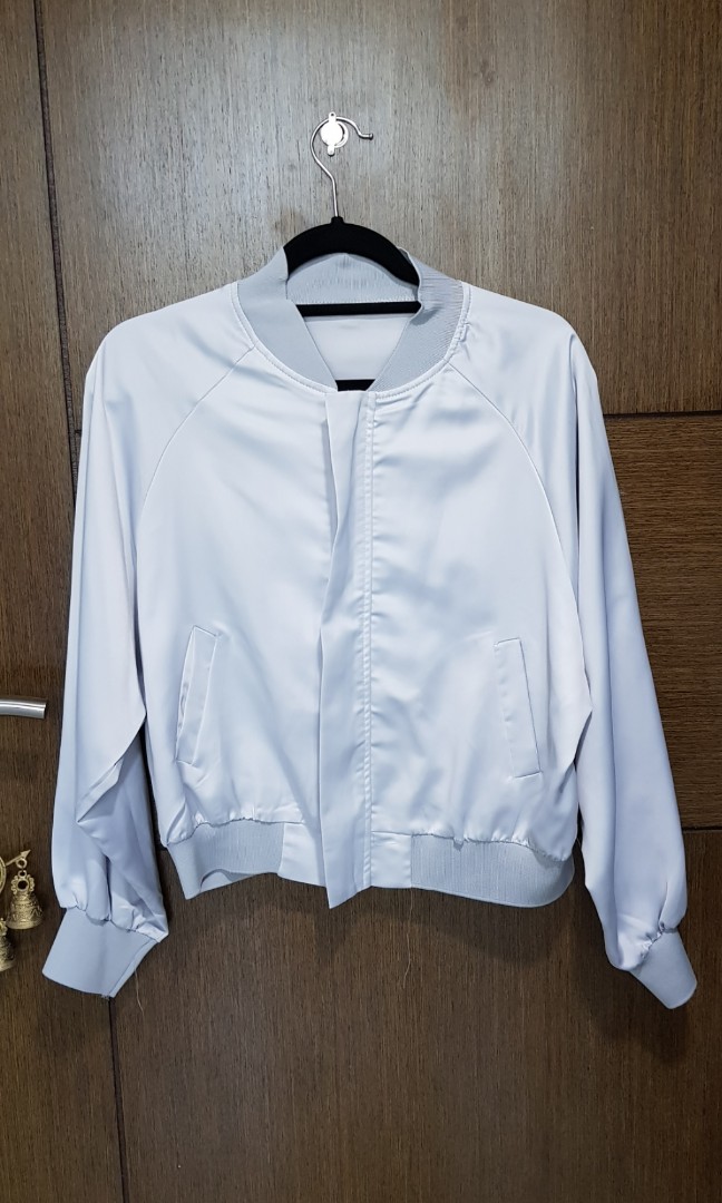 Silver/Grey Satin Bomber Jacket from Hong Konh (Category: Coats, Jackets and Outerwear) located in Quezon City. Submitted by joygamboa (Listing ID 176837492, Image 1). Description: -Bought this in Hong Kong for about 400HKD -It's lightweight! Perfect if you want to add an extra layer without feeling too warm - Slightly Negotiable - Brand New.