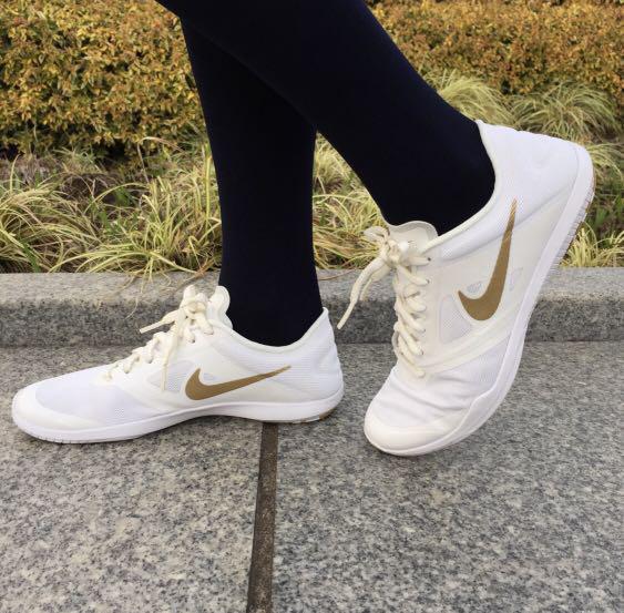 white and gold nike trainers