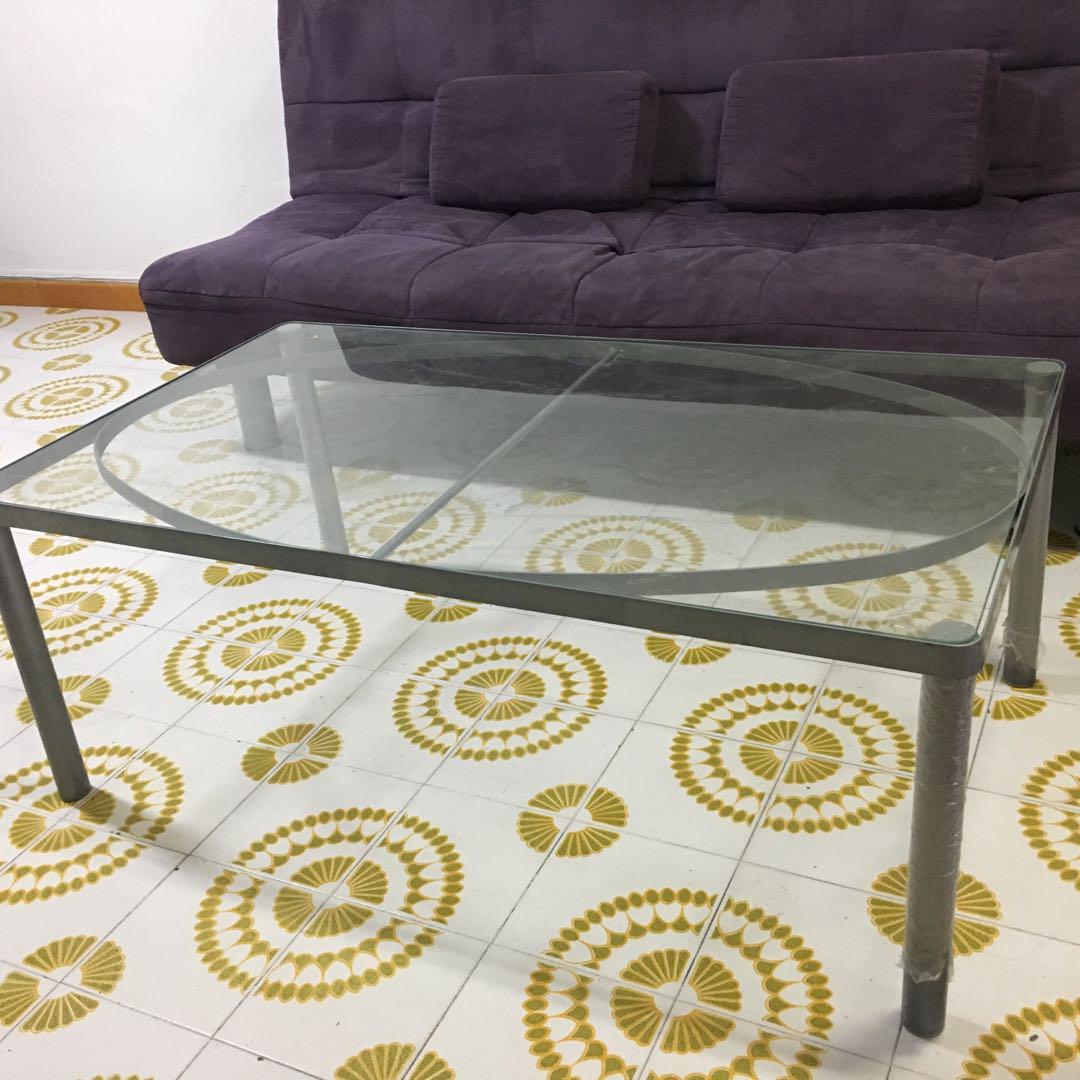 Coffee table (Category: Tables & Sets) located in Singapore. Submitted by esquire007 (Listing ID 177349490, Image 3). Description: Coffee table with glass TOP with grey metal frame. Easy to blend Dimension : 110x43x63 Still Good condition. .