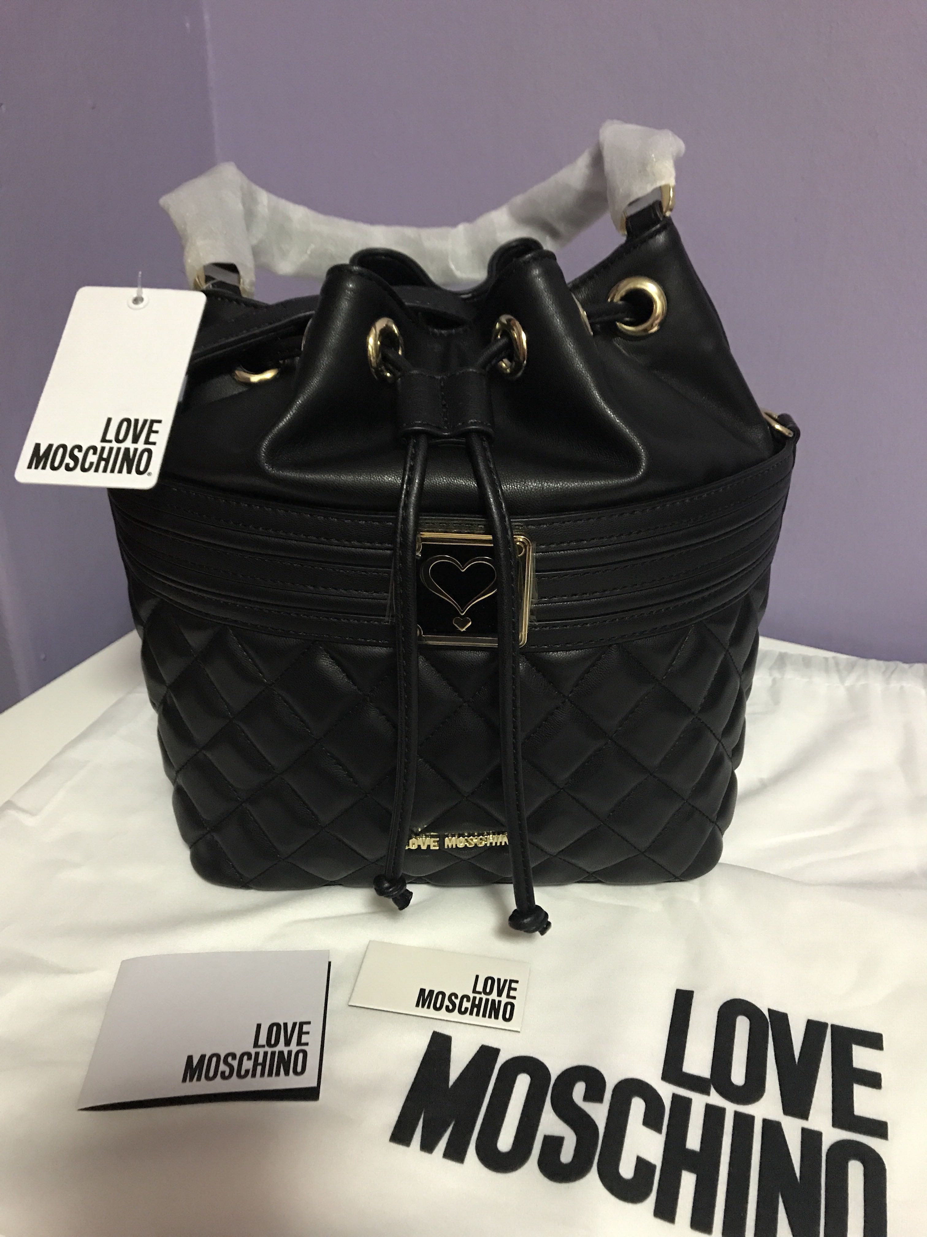 Love Moschino detachable pocket backpack with chain in black | ASOS