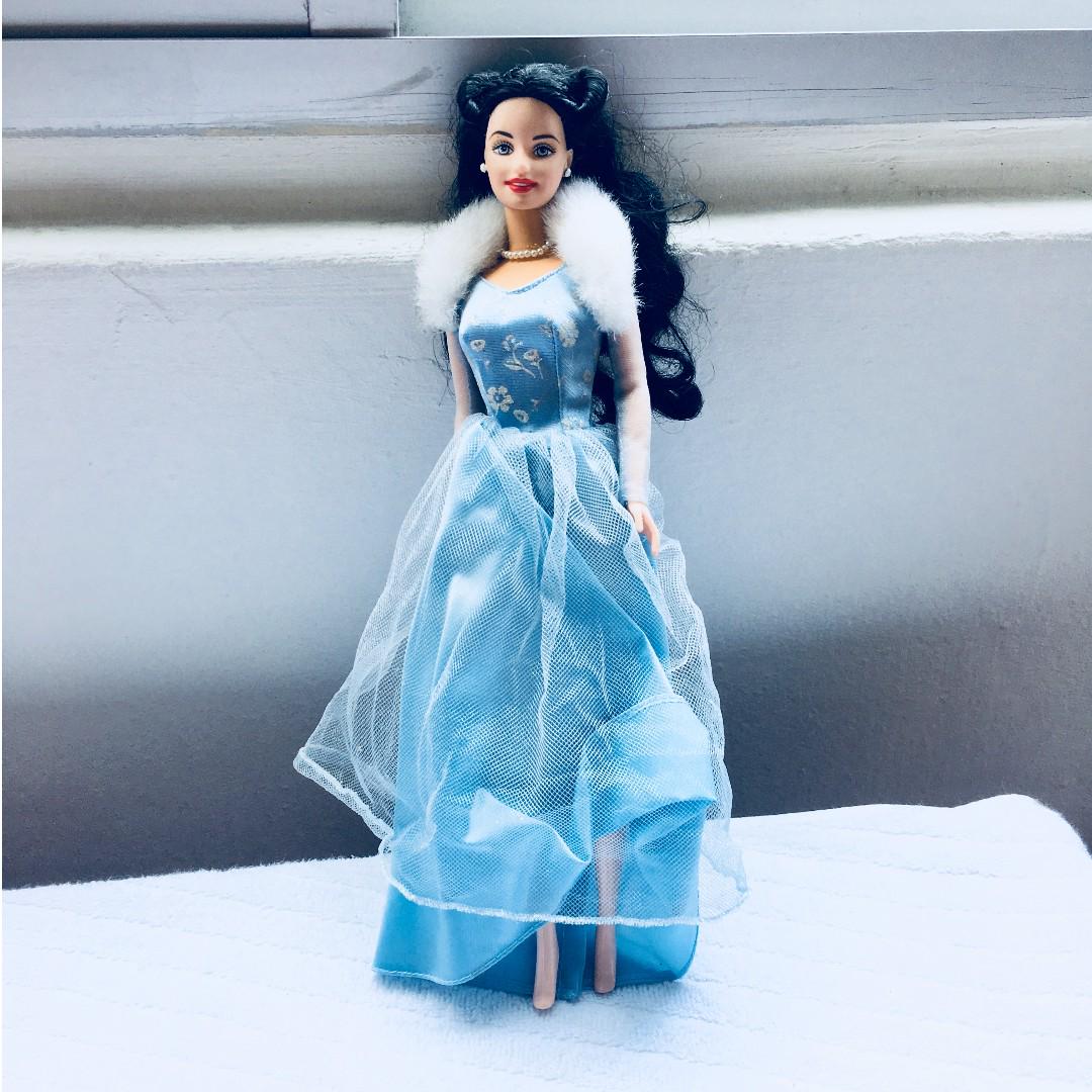 barbie doll in blue dress