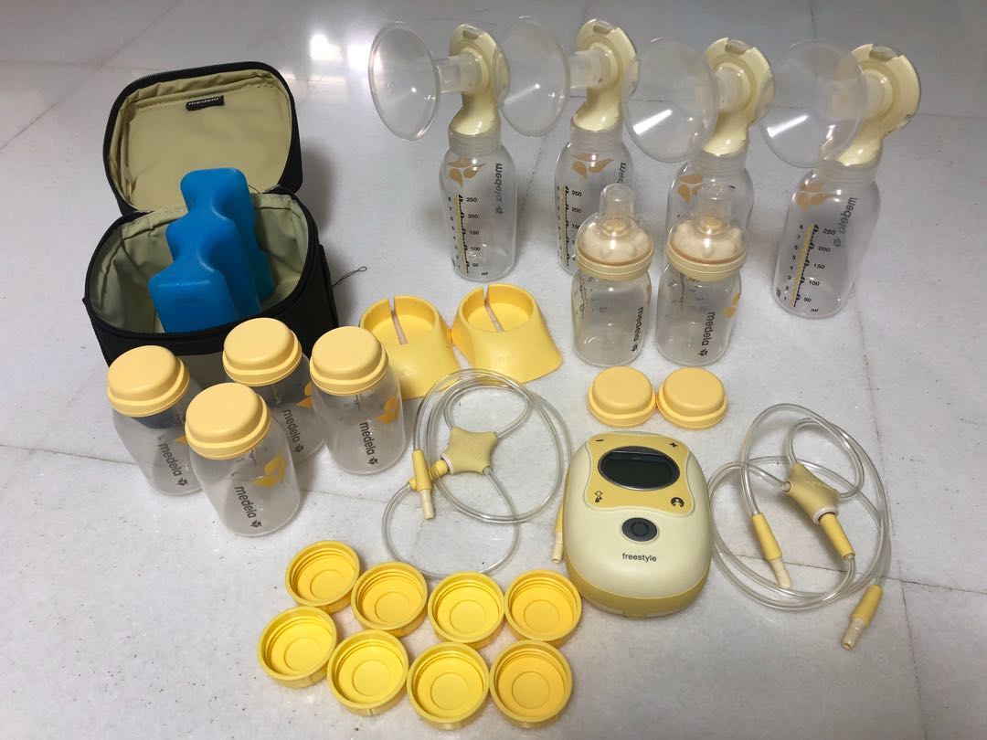 Medela Freestyle Breast Pump, Cooler set, Extra Pump Parts and Bottles