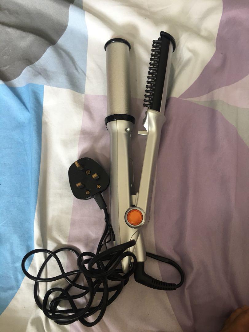 Hair straightener with rolling cylinder deals