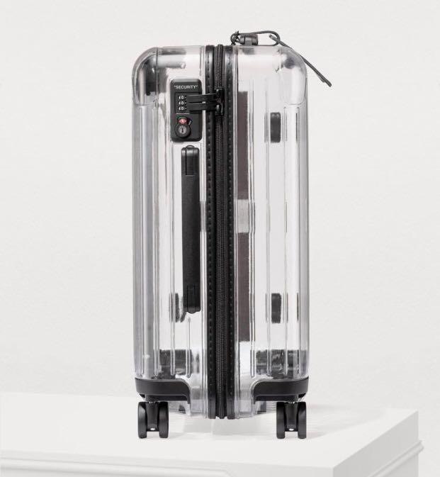 off white clear suitcase