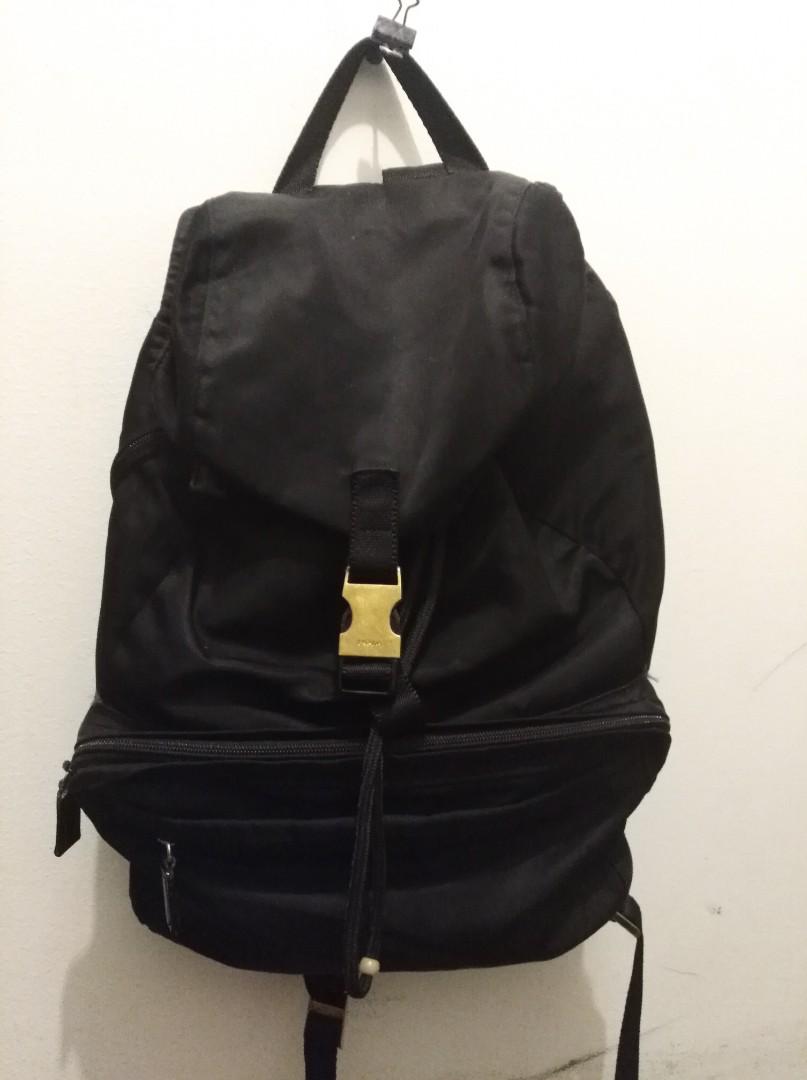 Prada Backpack (Category: Women's Bags & Wallets) located in Kogarah. Submitted by dreamout (Listing ID 178666324, Image 2). Description: DROPPED FROM 1200 TO 580 Really want gone before moving house Black Prada Milano Backpack Bag Perfect Condition Don't use backpacks so please take it instead. No scammers pls❌ Buckle has been painted gold.Everything else is original..