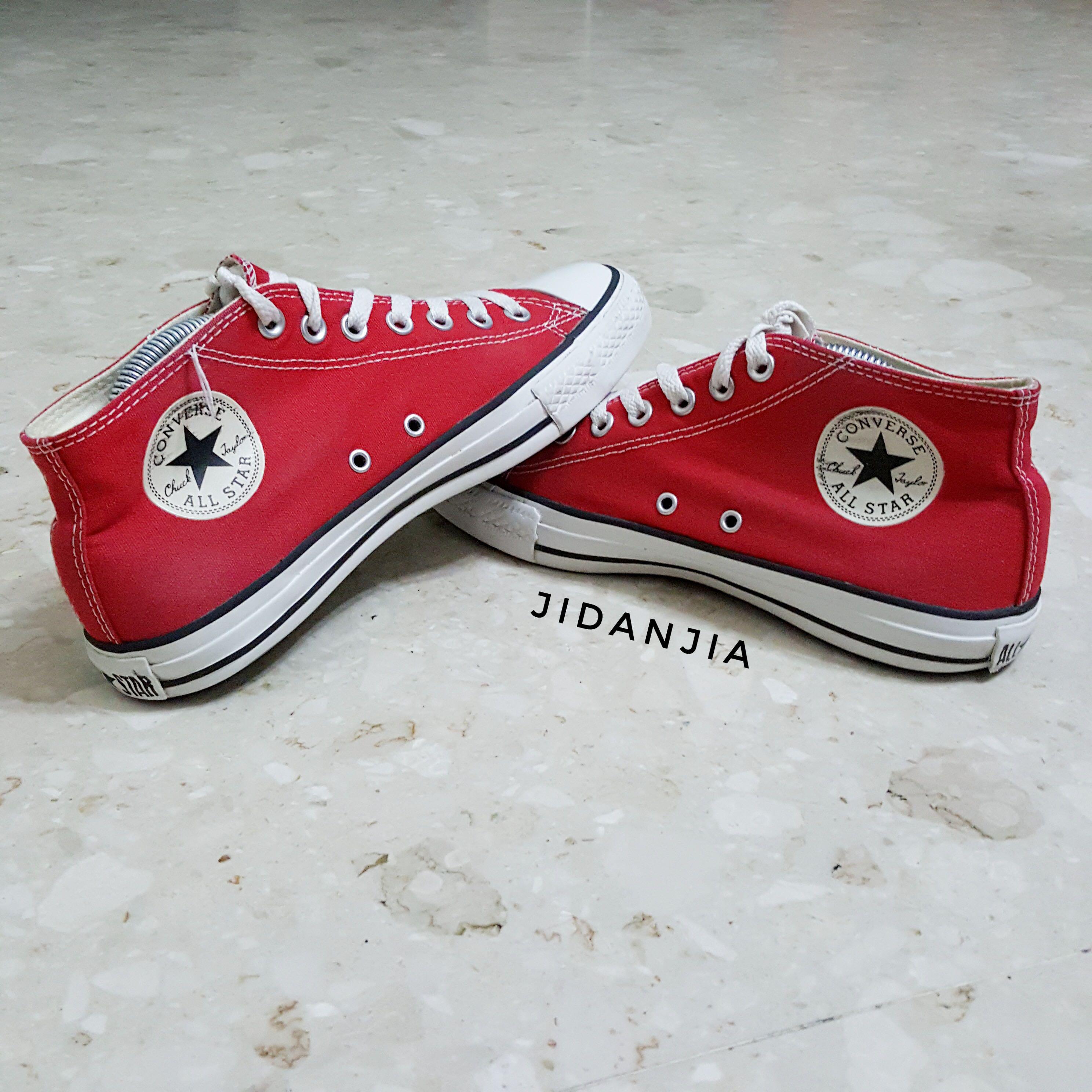 Red mid top hotsell converse