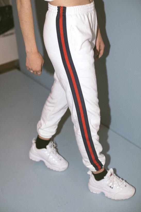 white sweatpants with red stripes