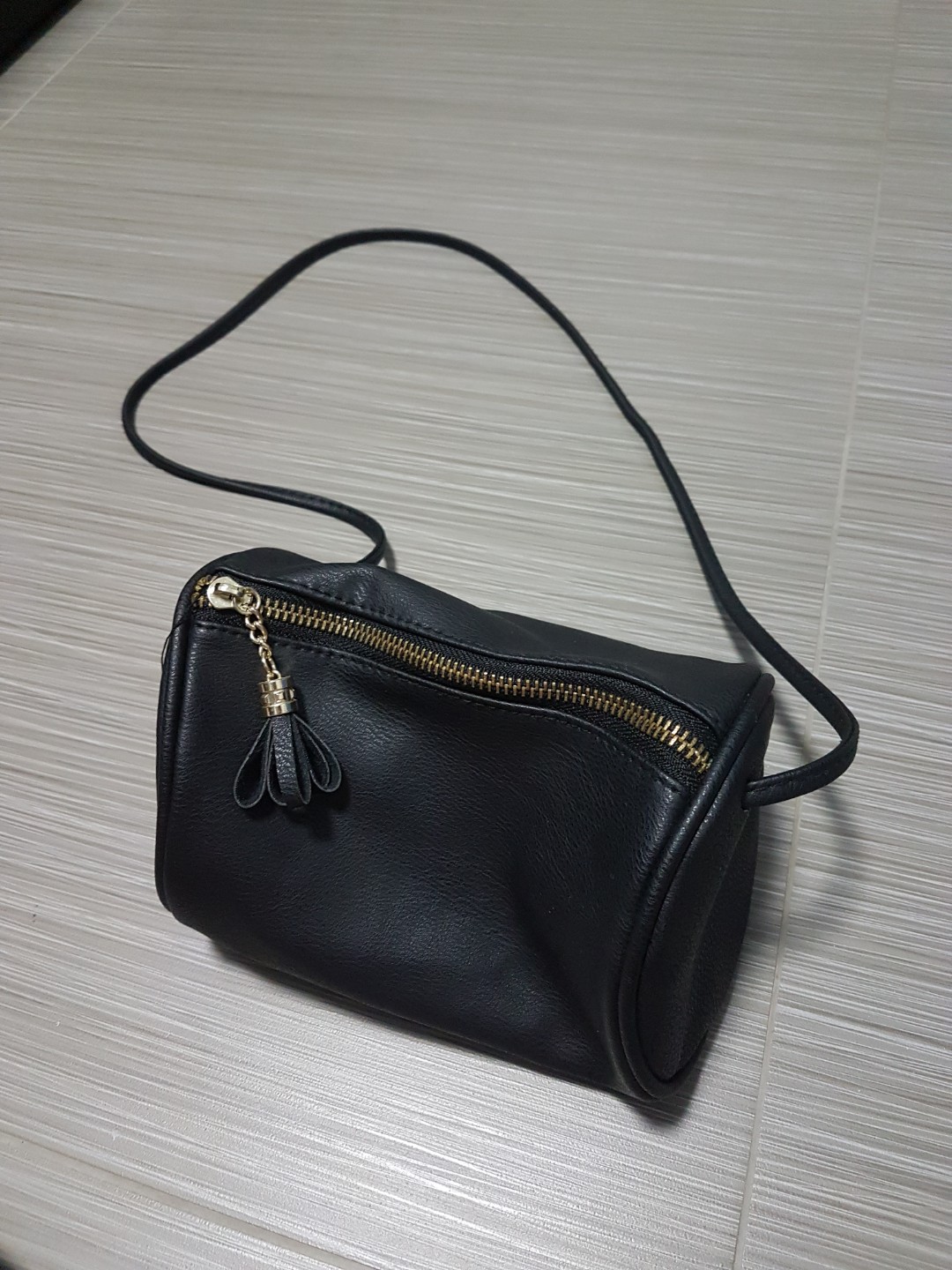 cylindrical sling bag