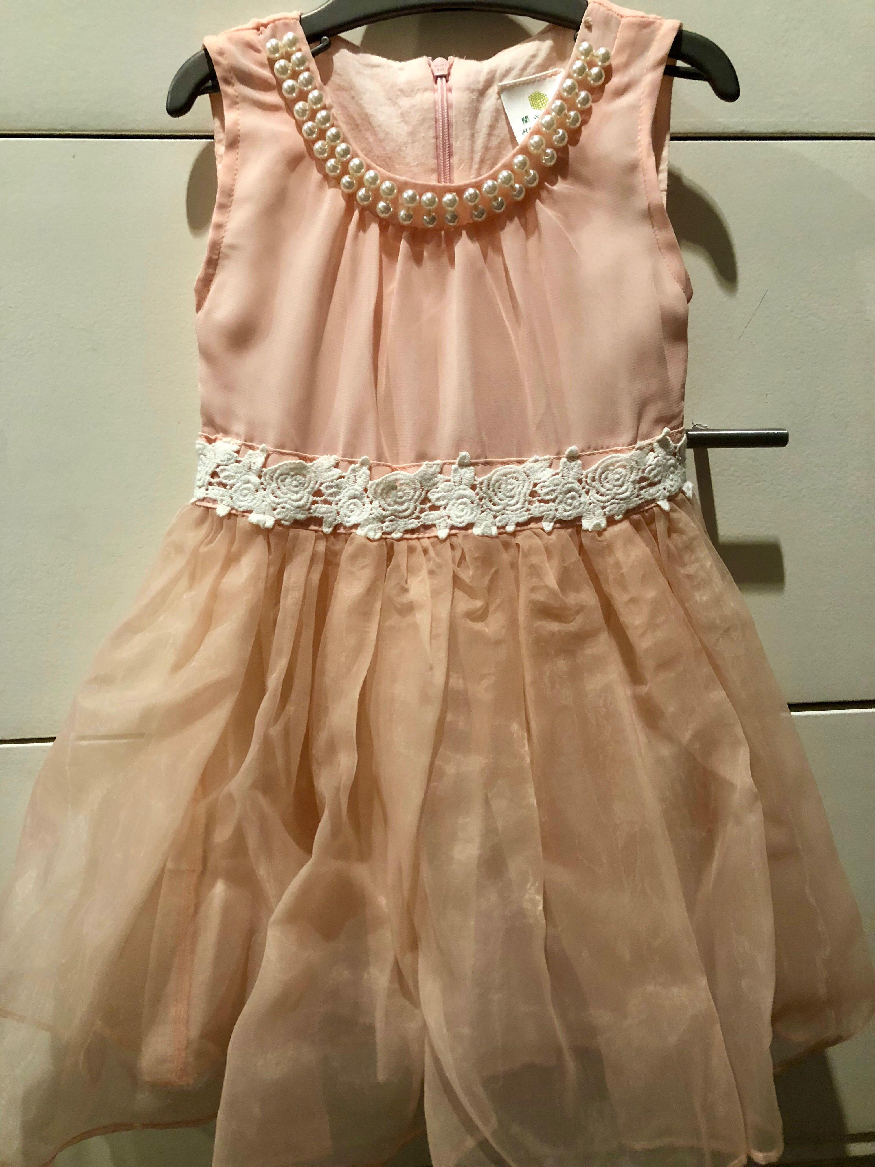 Peach dress with pearls (Category: Babies & Kids Fashion) located in Marikina City. Submitted by crissy53014 (Listing ID 180426509, Image 1). Description: Beautiful dress used once for a wedding .