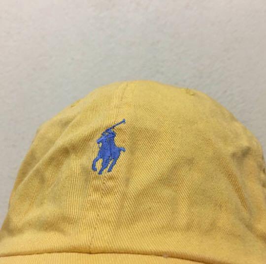 yellow polo hat with leather strap