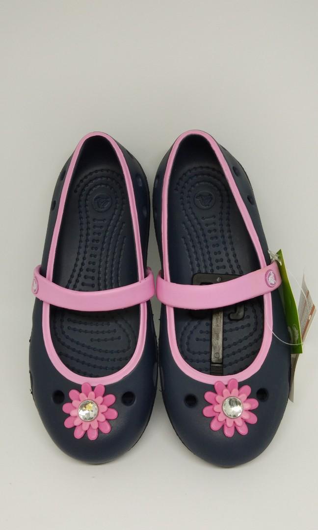SALE 100 Authentic CROCS Girls Keeley Petal Charm Flat in Navy Carnation Babies Kids Babies Kids Fashion on Carousell