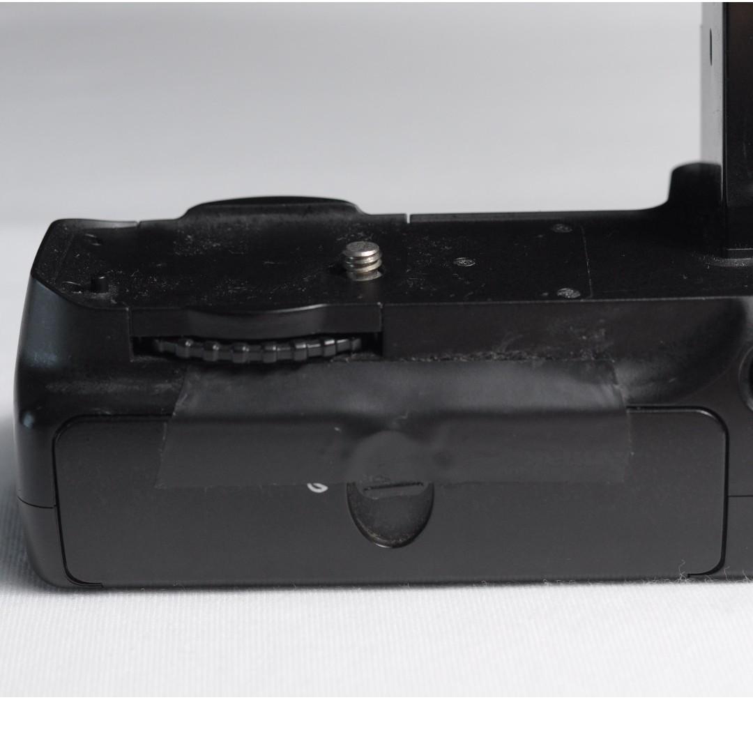 Phottix BP-D80 Battery Grip for Nikon D90/D80 (Category: Batteries & Chargers) located in Manila. Submitted by 12121221 (Listing ID 180737483, Image 3). Description: Working Condition Rarely Used Includes 6AA Battery adapter Issue: The pin used to lock the battery door is loose. It can be repaired but I use tape instead. (Shown on Photo) Negotiable .