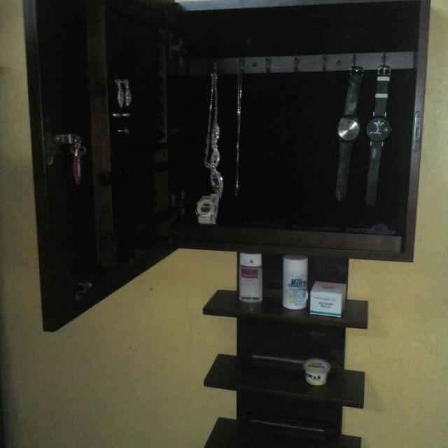 Elegant Mirror with jewrerly cabinet (Category: Shelves, Cabinets & Racks) located in Quezon City. Submitted by shopsky28 (Listing ID 180892346, Image 1). Description: Elegant mirror with jewerly cabinet Made in US wood kaya mabigat pang yayamanin bes! 😍 Brand new! Pull out from mall (homeworks) 3500 original price selling for 1,800 only! Negotiable price!.