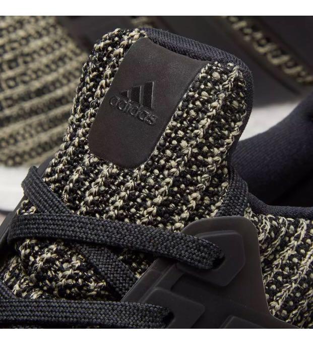 Ultra boost black raw gold hotsell