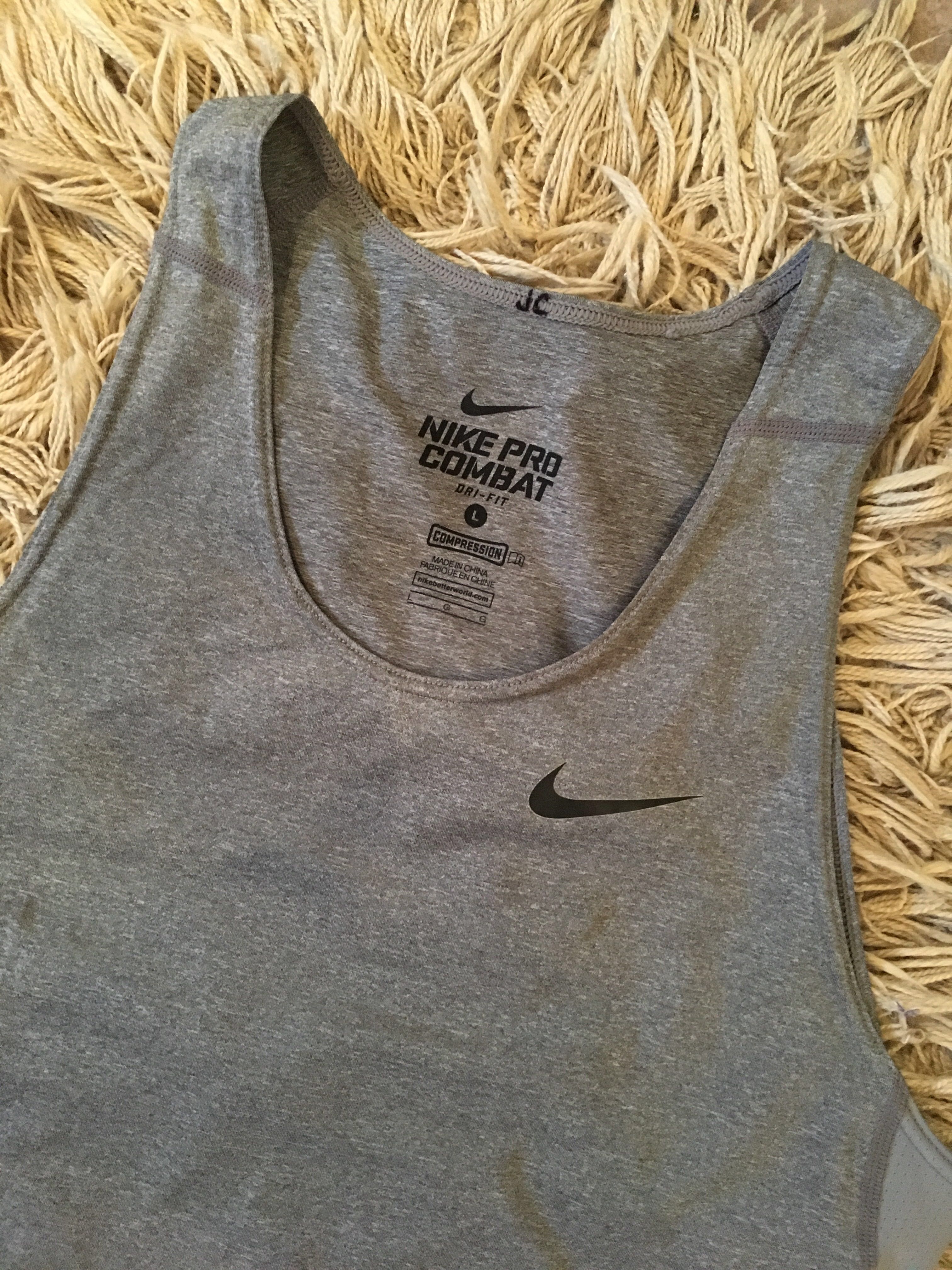 https://media.karousell.com/media/photos/products/2018/07/29/nike_pro_combat_compression_tank_top_1532856441_35182bbe.jpg