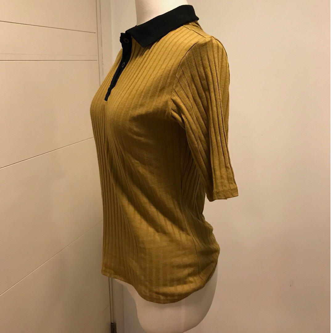 mustard yellow polo shirt